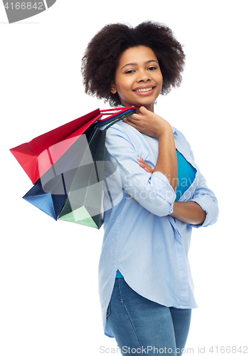 Image of smiling afro american woman with shopping bags