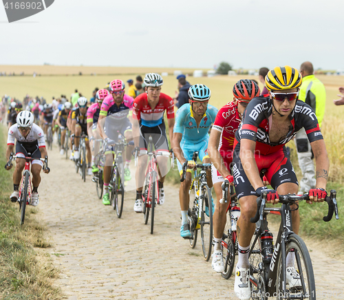 Image of The Peloton on a Cobblestone Road - Tour de France 2015