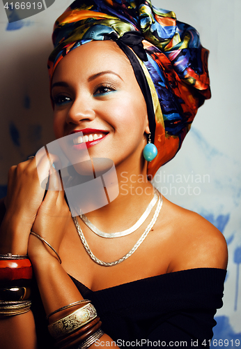 Image of beauty bright african woman with creative make up, shawl on head like cubian