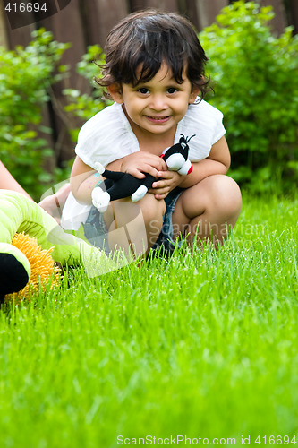 Image of Playing outside with her toys