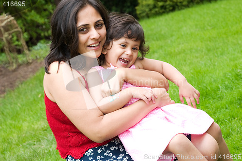 Image of Mother and daughter playing outside