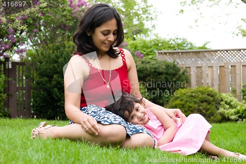 Image of Mother and daughter playing outside