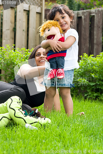 Image of Mother and daughter playing outside