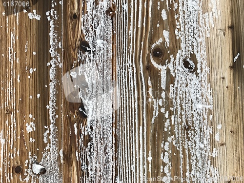Image of old wood covered with snow background