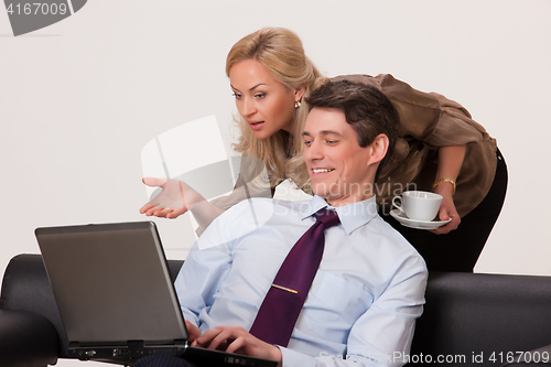 Image of Woman And Man At The Computer