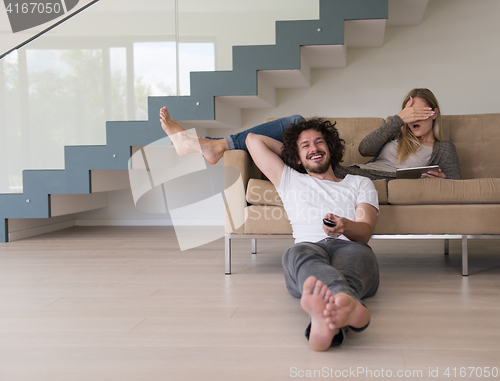 Image of young couple relaxes in the living room