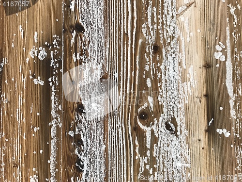 Image of old wood covered with snow background