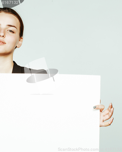 Image of young pretty brunette girl with placard on white background