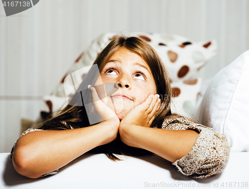 Image of little cute girl at home smiling