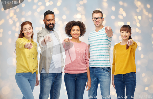 Image of international group of people pointing on you