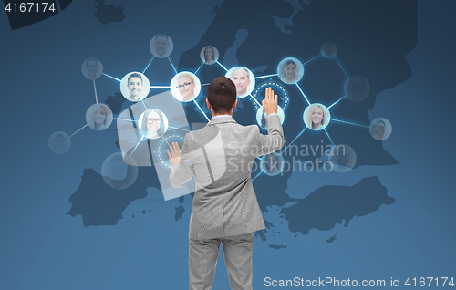 Image of businessman using virtual screen with contacts