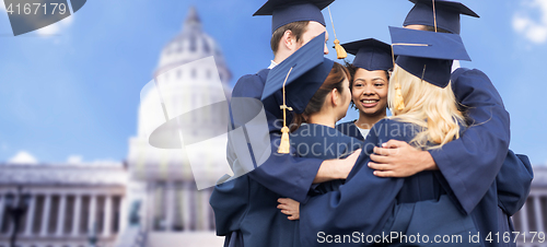 Image of happy students or bachelors hugging