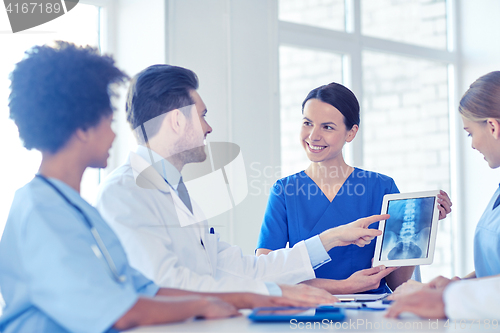 Image of group of happy doctors meeting at hospital office