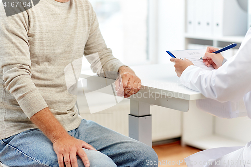 Image of close up of senior man and doctor at hospital