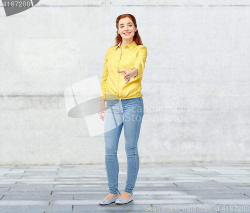 Image of happy woman giving hand for handshake over white