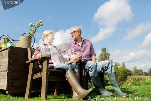 Image of happy senior couple at summer farm