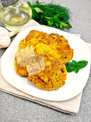 Image of Flapjack chickpeas with zucchini in plate on stone table