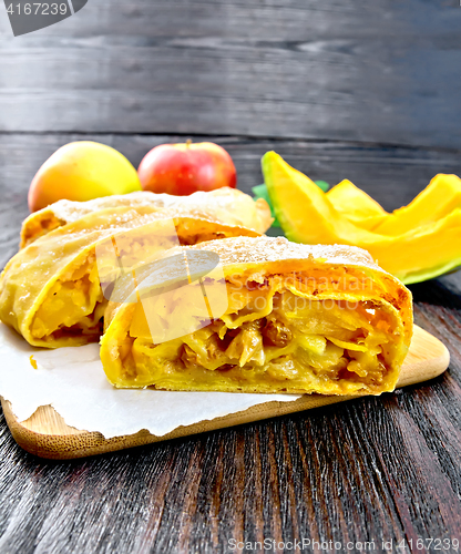 Image of Strudel pumpkin and apple with raisins on board