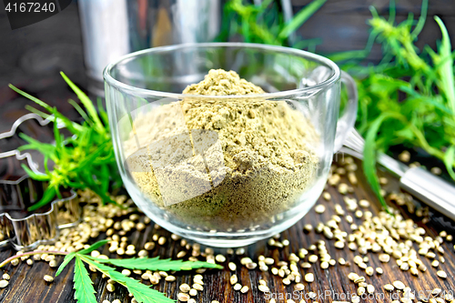 Image of Flour hemp in glass cup on dark board