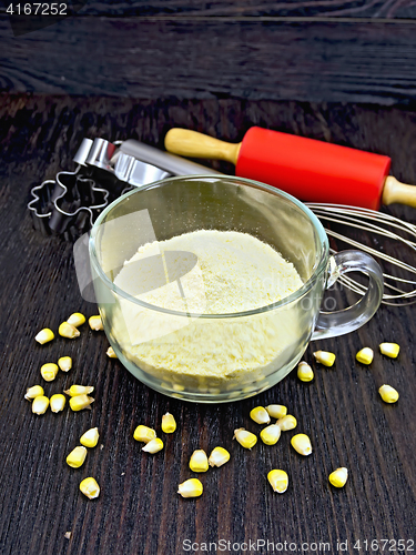 Image of Flour corn in cup on dark board