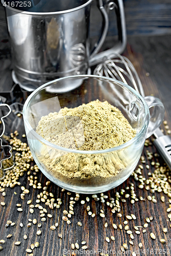 Image of Flour hemp in glass cup with mixer on board