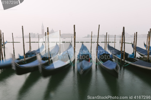 Image of Gondolas at their moorings in Venice, Veneto, Italy, Europe