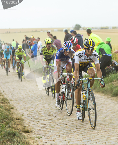 Image of The Peloton on a Cobblestone Road - Tour de France 2015