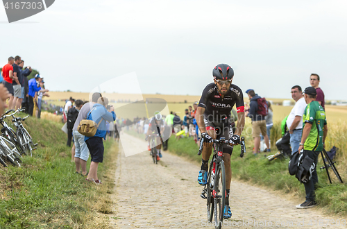 Image of Jose Joao Mendes Pimenta Costa Riding on a Cobblestone Road - To