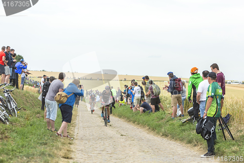 Image of Jose Joao Mendes Pimenta Costa Riding on a Cobblestone Road - To