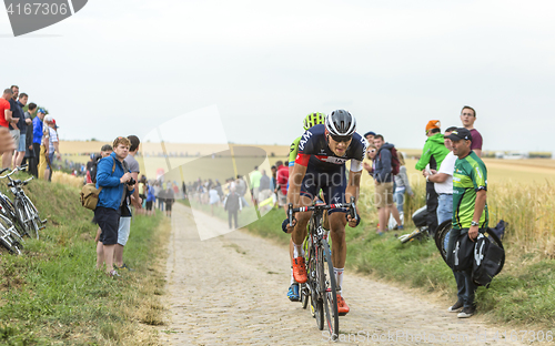 Image of The Cyclist Matthias Brandle Riding on a Cobblestone Road - Tour