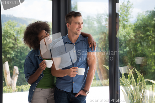 Image of romantic happy young couple relax at modern home indoors