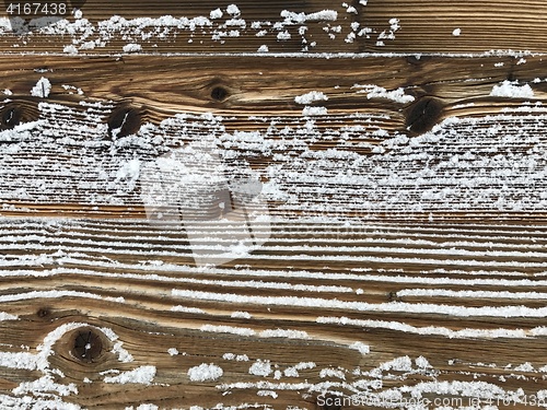 Image of old wood covered with snow background