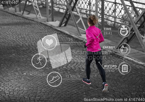 Image of Woman running across the bridge