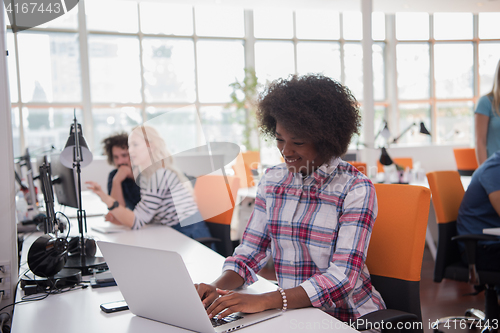 Image of African American informal business woman working in the office