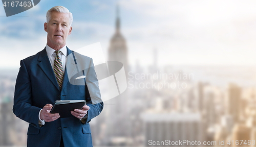 Image of Portrait of smiling senior businessman