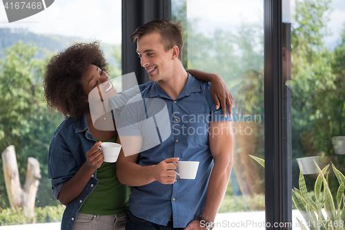 Image of romantic happy young couple relax at modern home indoors