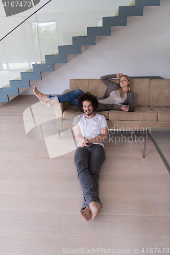 Image of young couple relaxes in the living room