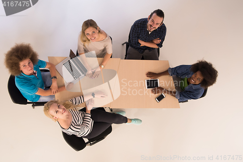 Image of Multiethnic startup business team on meeting  top view