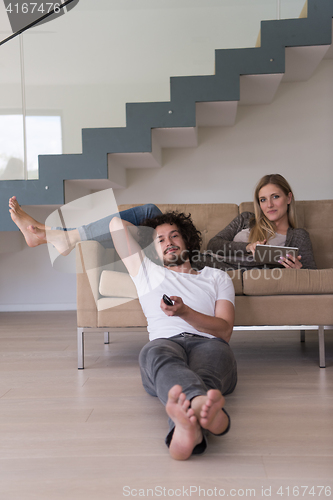 Image of young couple relaxes in the living room