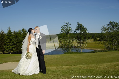 Image of Wedding couple kissing