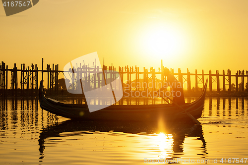 Image of Fishman under U bein bridge at sunset