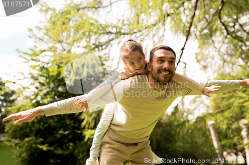 Image of happy family having fun in summer park