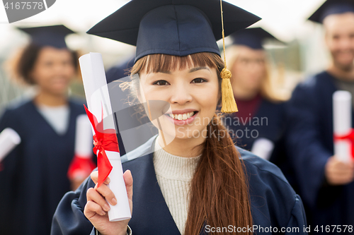 Image of close up of happy student or bachelor with diploma