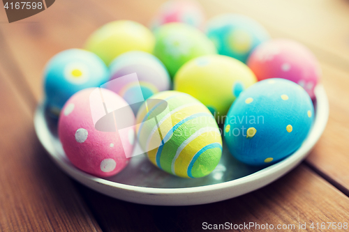 Image of close up of colored easter eggs on plate