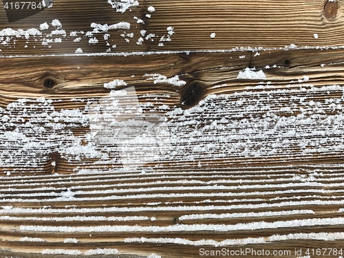 Image of old wood covered with snow background