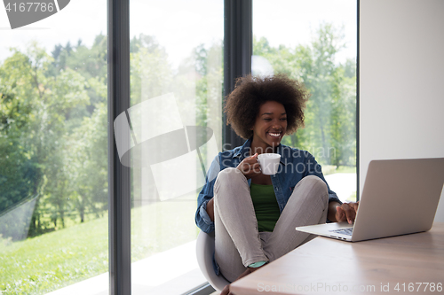 Image of African American woman in the living room