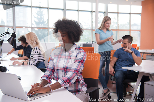 Image of African American informal business woman working in the office