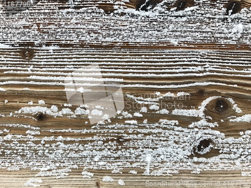 Image of old wood covered with snow background