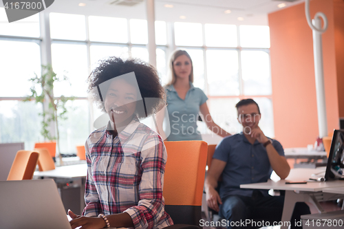 Image of African American informal business woman working in the office