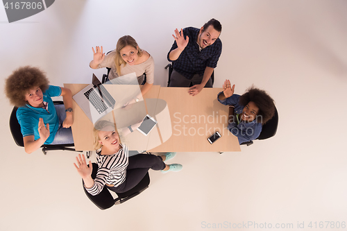 Image of Multiethnic startup business team on meeting  top view